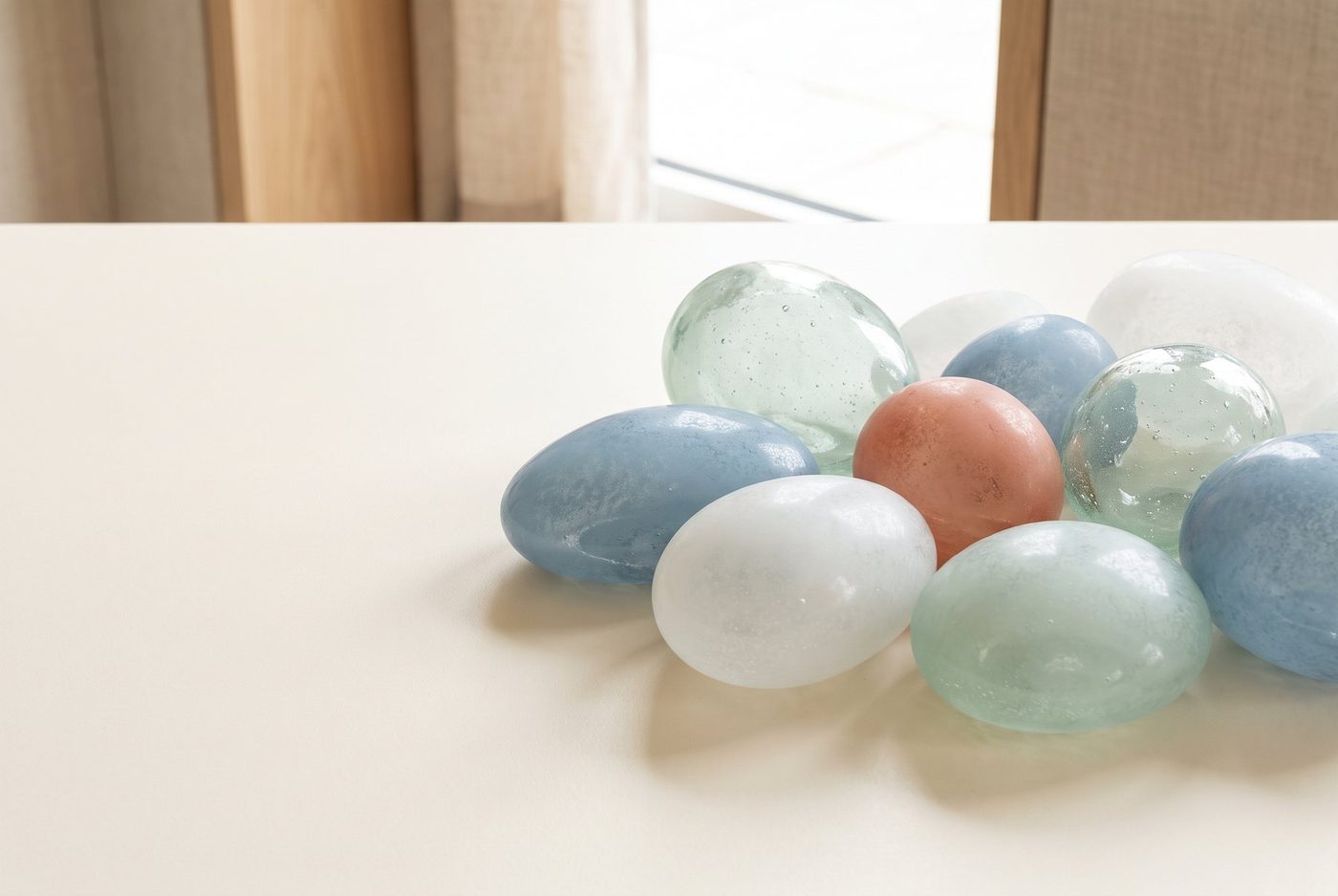 Ghloo stones: glass and matte stones resting together on a table